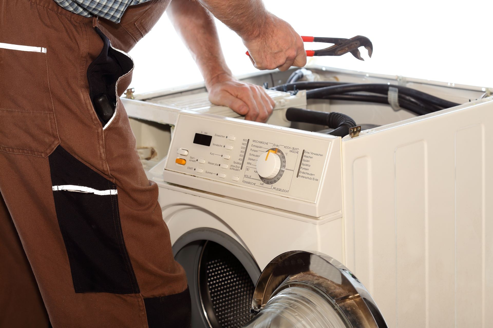 electrician is repairing a clothes washer with gripper